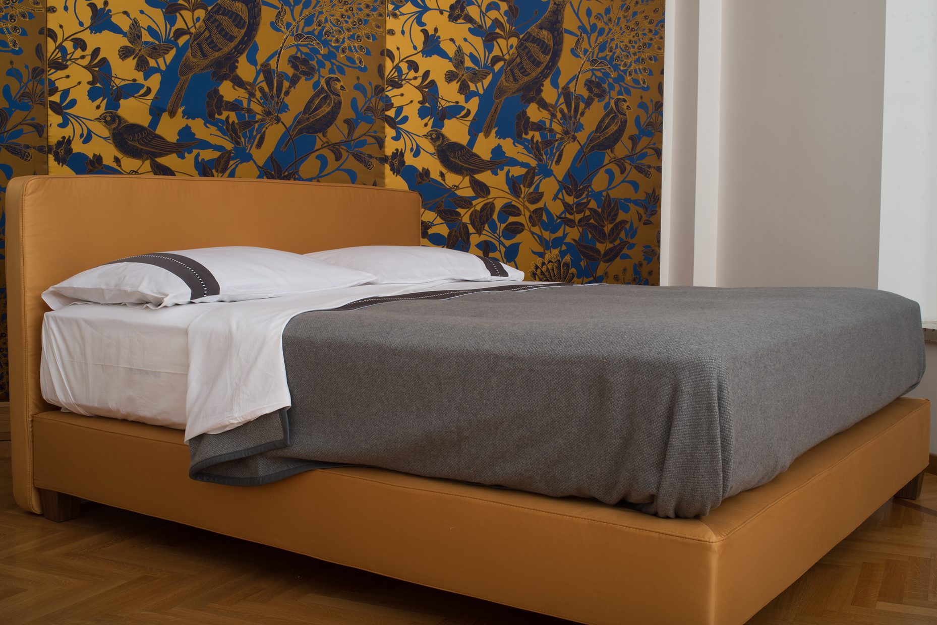 The blue-and-gold room, the bed made up.