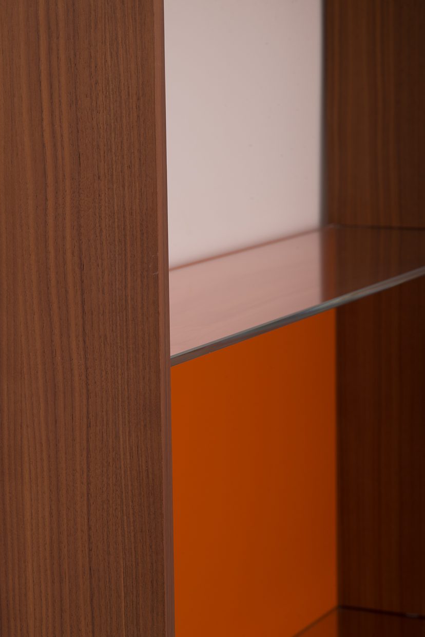 Walnut and orange lacquer.