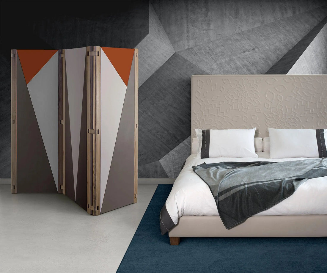 Luxury bed with a textured headboard and a modern geometric folding room divider.