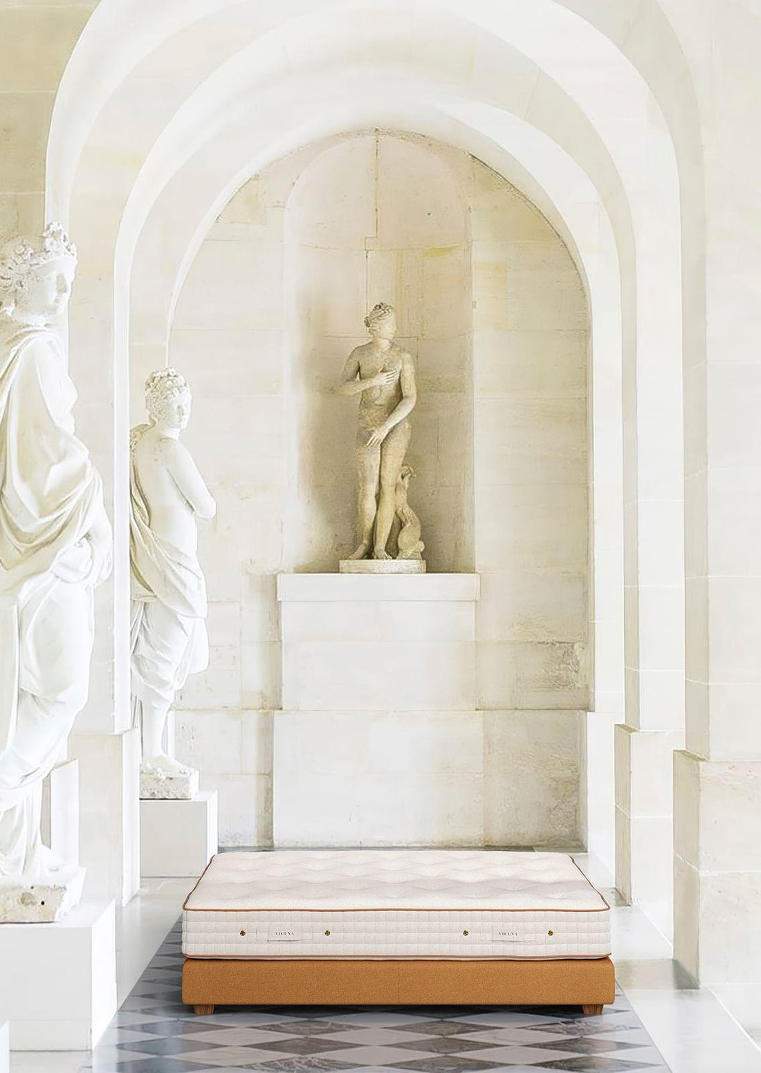 Luxury mattress with natural materials in elegant hall with classical marble statues